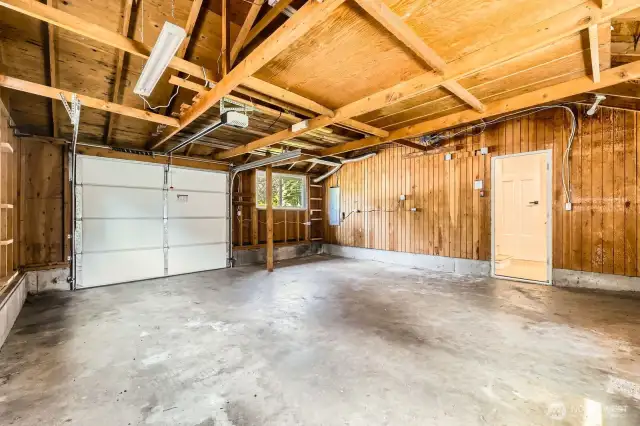 A one-car garage, which is significantly larger than normal. Excellent storage space above to keep items off the floor