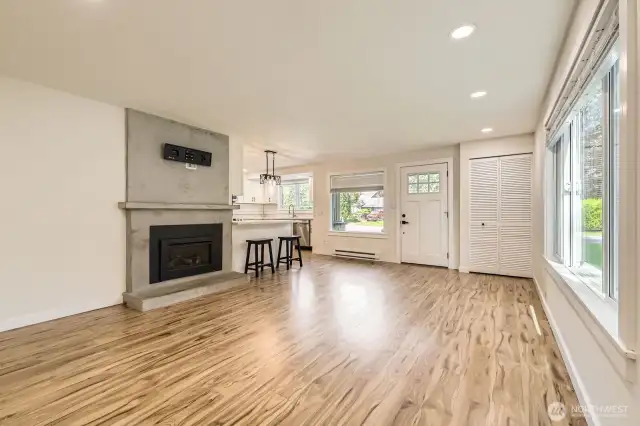 Built-in TV adjustable rack above the fireplace. All new lighting in the home makes it nice and bright