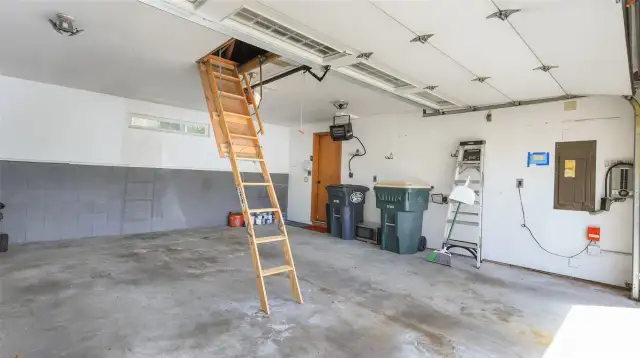 2 car garage with pull-down stairs to storage. Wired for generator. Heated. Also electric car charging.