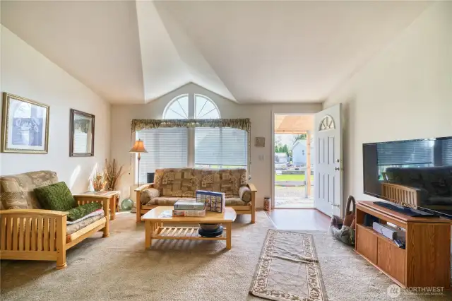 Enjoy the welcoming living room with large windows