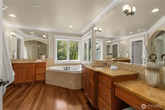 Large ensuite bath with dual vanities, soaking tub...