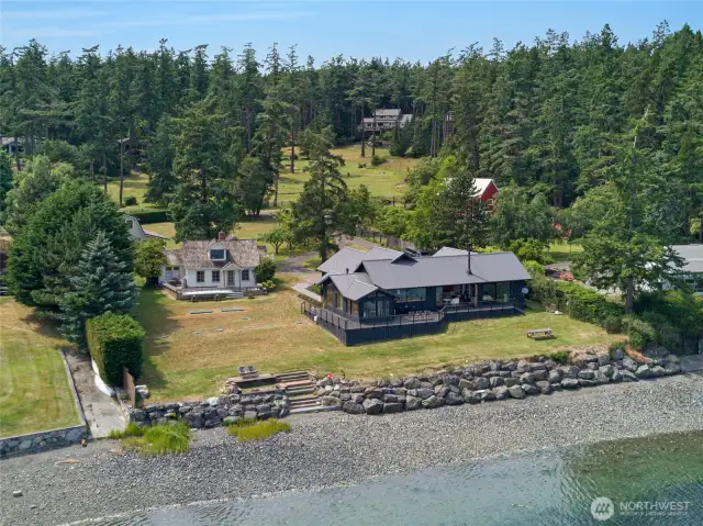Nestled along the coast of the Salish Sea with 150 ft of low bank shoreline sits this perfect retreat with main house, historic farmhouse and barn-style shop with apartment.