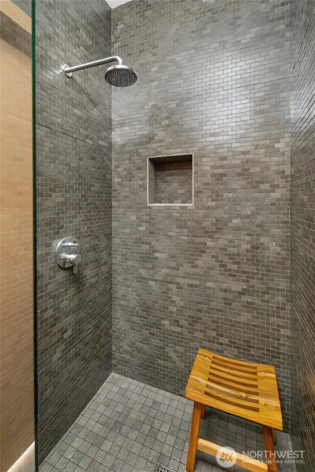The shower room next to the powder room off the hallway.
