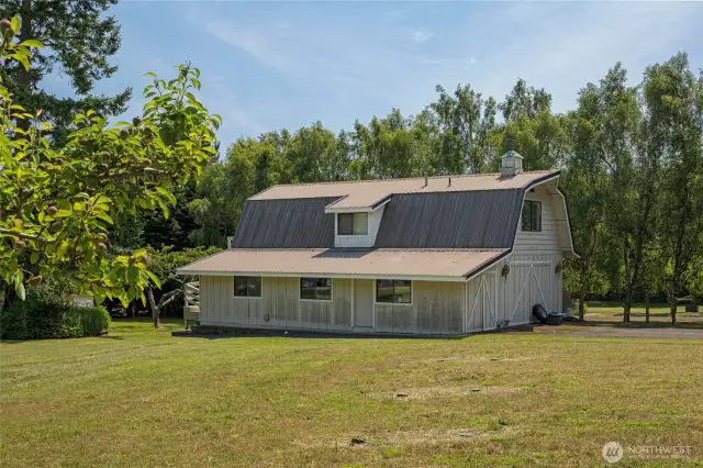 The barn-style shop and garage with apartment above.
