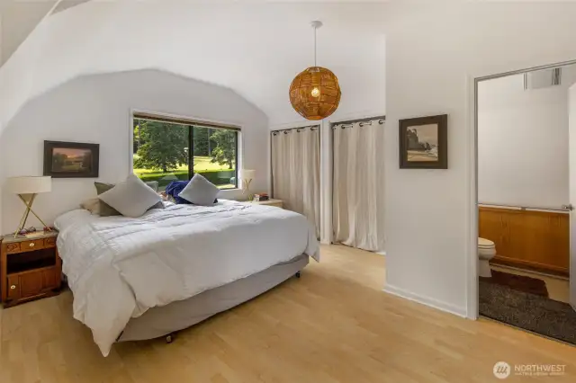 The bedroom in the apartment above the shop. The door on the right leads to the bathroom.