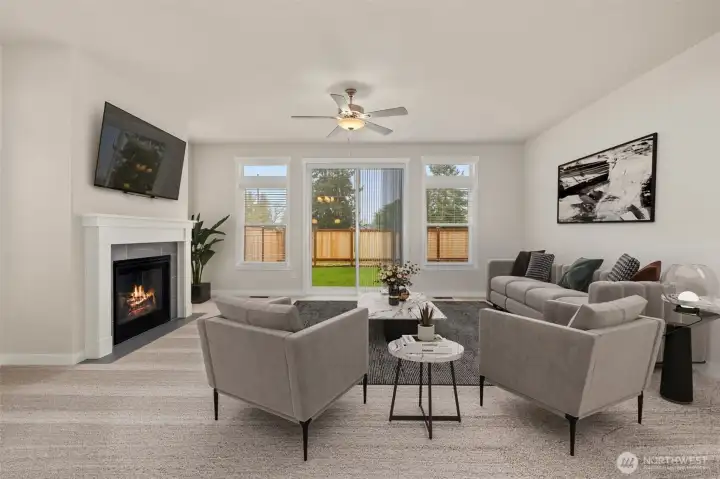 Light & Bright! Virtually staged photo showing the oversized window and white trim and millwork