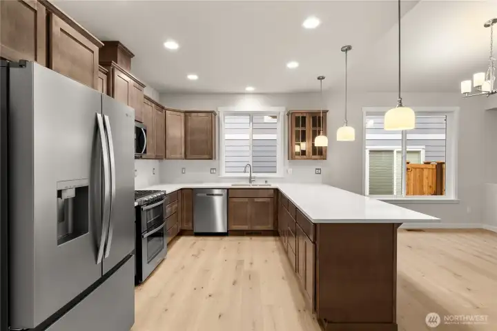 Whirlpool stainless steel gas double oven is standard as well as dishwasher and microwave. This home includes a refrigerator.