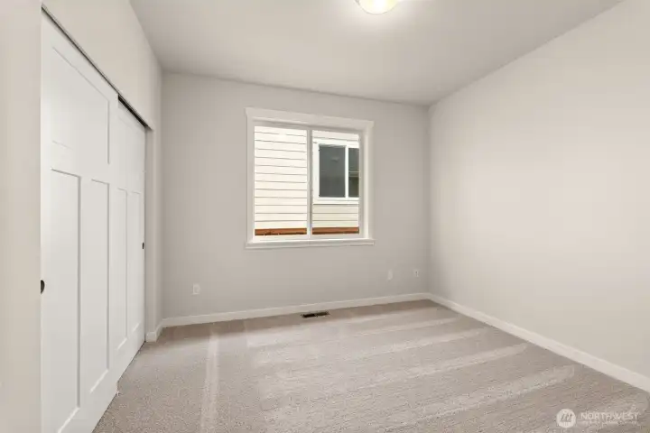 Adjacent to full bathroom is the second bedroom featuring a large reach-in closet.