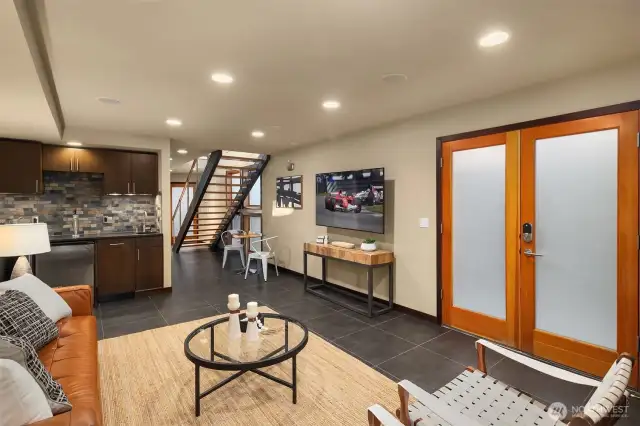 Spacious lower level offer French doors and floating staircase.
