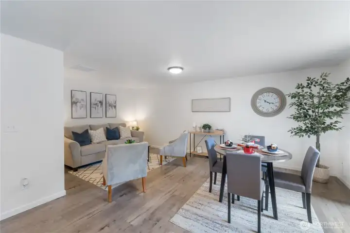 Eating space & family room area off of the kitchen.  Slider opens to fully fenced backyard with deck and firepit