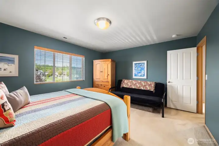 The primary suite has a lovely walk-in closet and a 3/4 bath.
