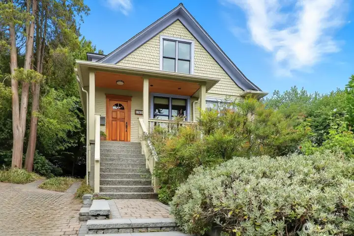 On a quiet, dead end street bordering sunny Judkins Park, find this proud 1904 Craftsman.