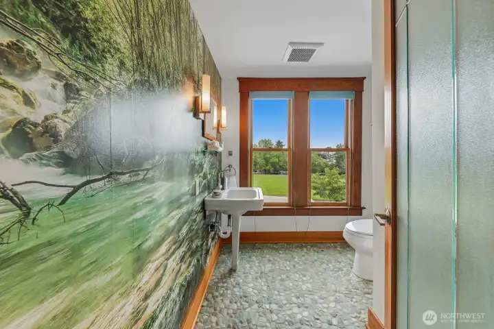 Views of the park, Rainier, and all-day natural light. A fabulous place to get ready in the morning. There's also tons of storage and washer/dryer hookups on this level!