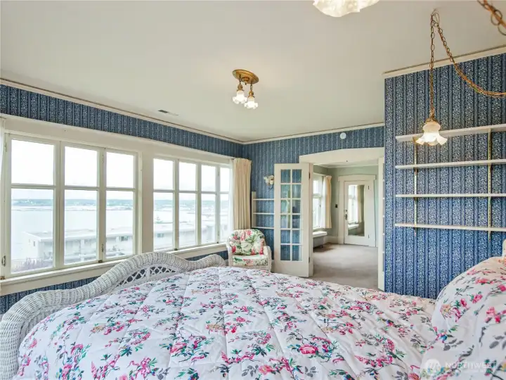 This is the primary bedroom with sweeping views of Bellingham Bay.