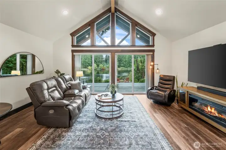 Vaulted ceilings create an open, inviting atmosphere drawing your eyes to the magificent views.  The windows and doors are trimmed in high end black walnut providing a warm and luxurious feel to the spaces.