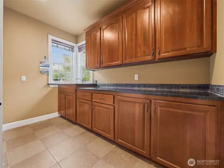 Look at all the cabinets in this laundry room