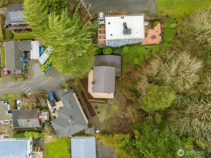 Yard space belongs to this home- seller has landscape designs for new owner.