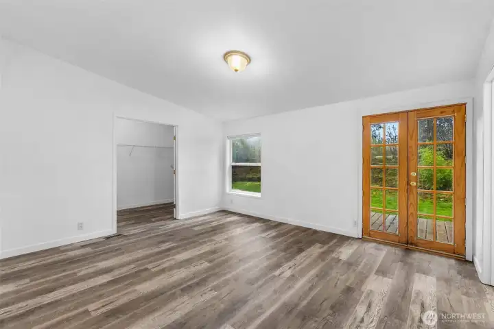 Primary Bedroom with french doors to the deck
