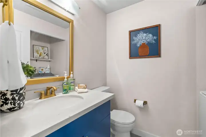 Main floor 1/2 bath with laundry, off the great room.