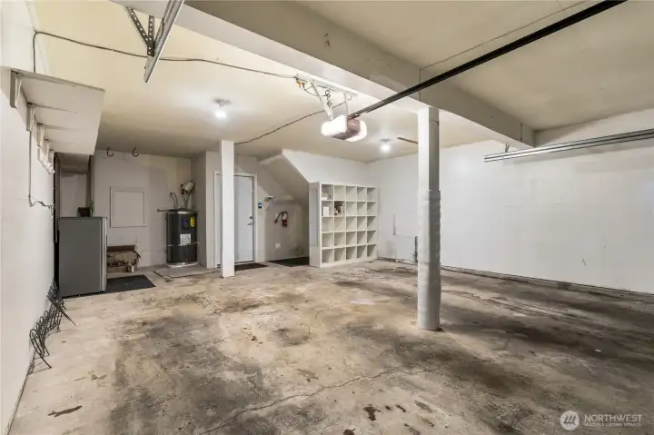 The two car garage with abundant storage, a new hot water tank and cube storage.