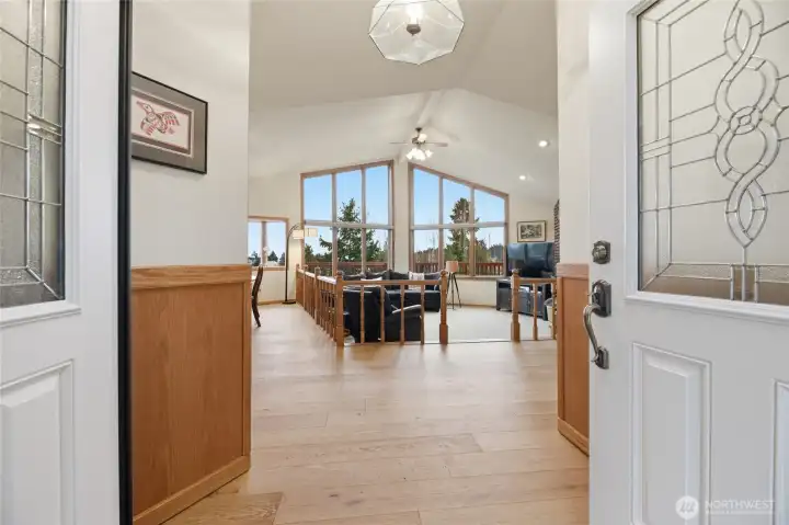 Beautiful double-door front entrance opens into the Great Room area. Stunning engineered hardwoods and brand-new windows greet you.