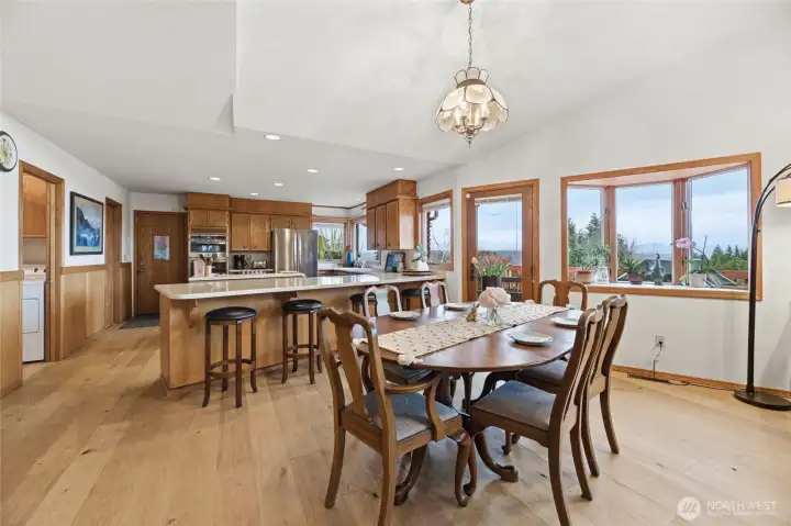 View of the dining room and kitchen, ample oak cabinets, large walk-in pantry and built-ins.