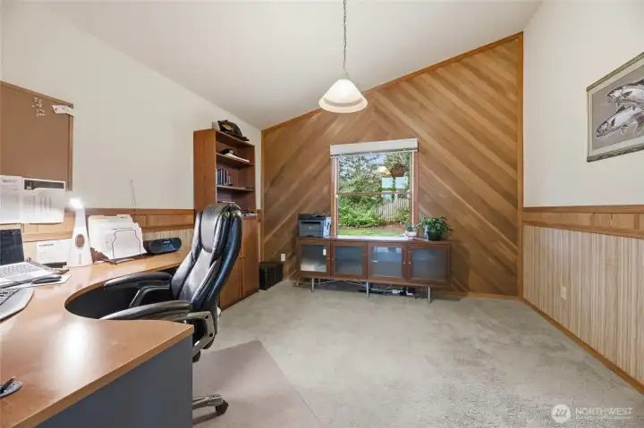 Den if just off the entry to the home.