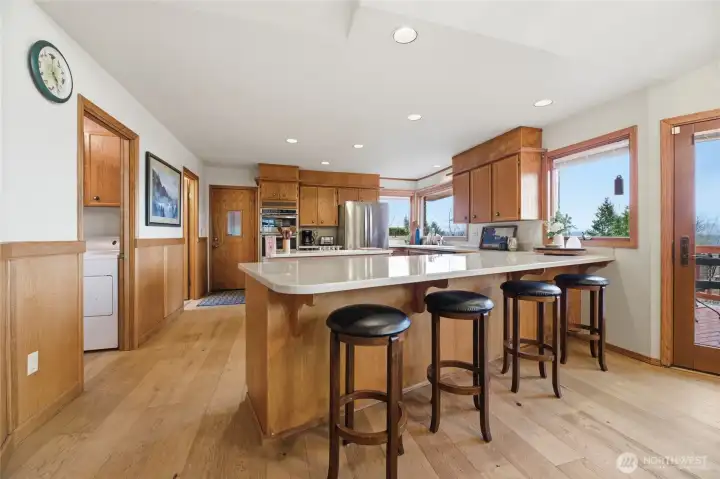 View of the large kitchen off to the left as you have entered the home. The kitchen is also accessed from the 3-car garage.