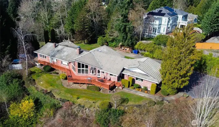Perched above the landscape with sweeping views of Mount Rainier and the surrounding foothills, this architecturally designed Northwest retreat invites you to slow down, breathe deeply, and savor the beauty of the changing skies. From sunrise glow to dramatic weather rolling across the valley, every day brings a new natural masterpiece right outside your windows. Thoughtfully positioned for privacy and tranquility, the home feels worlds away—yet it’s conveniently close to town, offering the perfect balance of seclusion and accessibility. Expansive windows, warm natural materials, and a layout that embraces the outdoors create a sense of calm the moment you step inside this classic, one-level home.