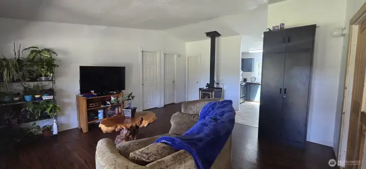Living Room with wood burning stove that heats the entire house.