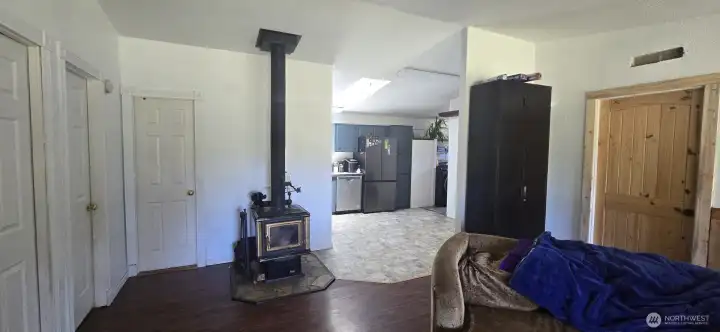View from living room into kitchen.2nd & 3rd bedrooms to the left, Primary to the right.