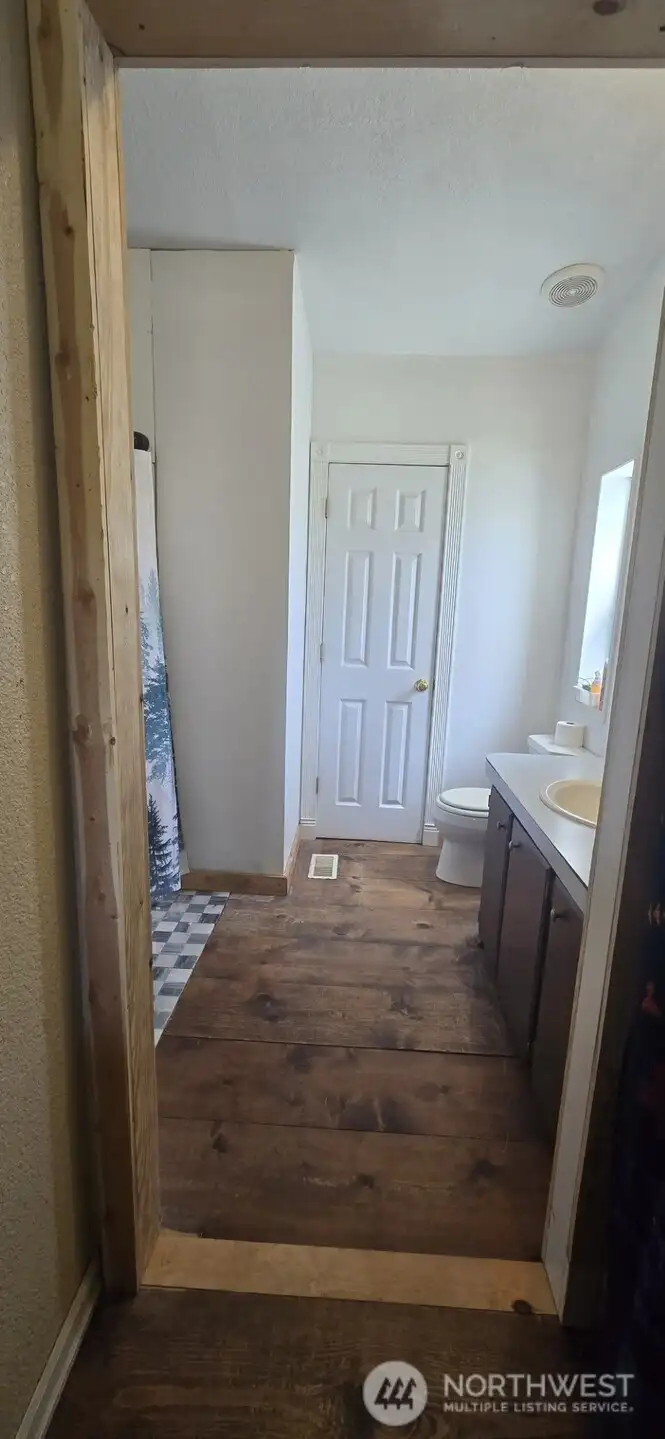 Primary Bathroom with 2nd door to laundry room