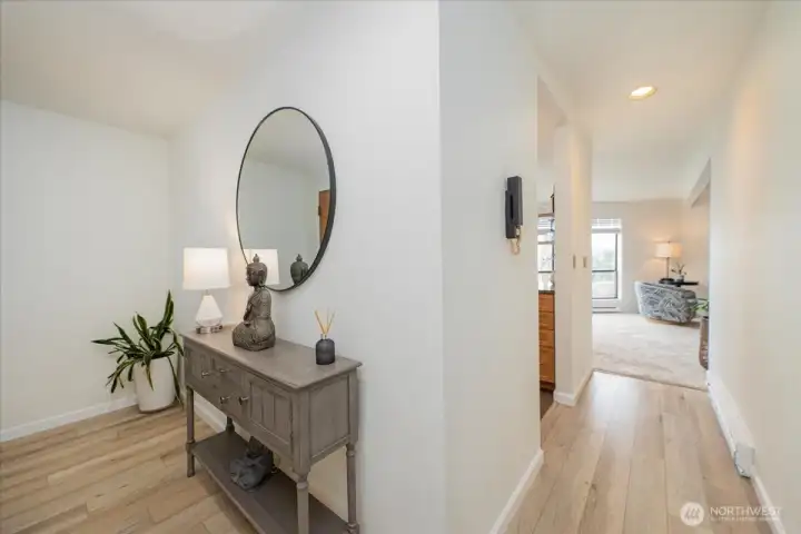 Foyer with beautiful laminate flooring.