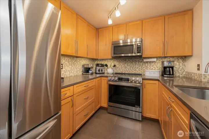 Remodeled kitchen with maple cabinets.