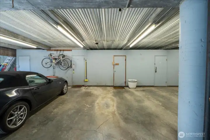 Secured Garage with 1 parking space and a storage unit.