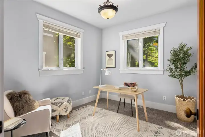 The main level home office is tucked off the kitchen/dining.