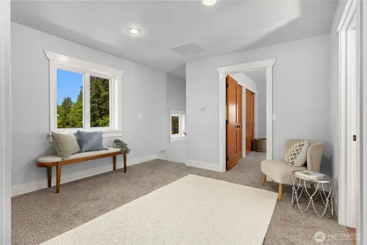 Upstairs, the second floor features a central landing that is flexible space.