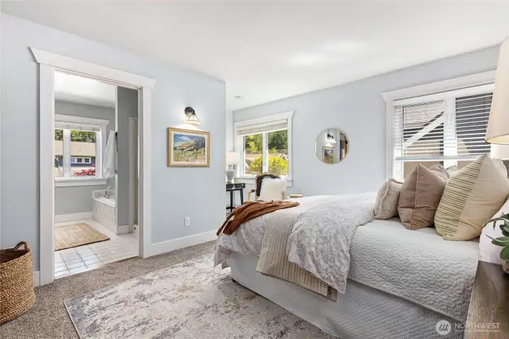 Primary ensuite features a spa-like bath.