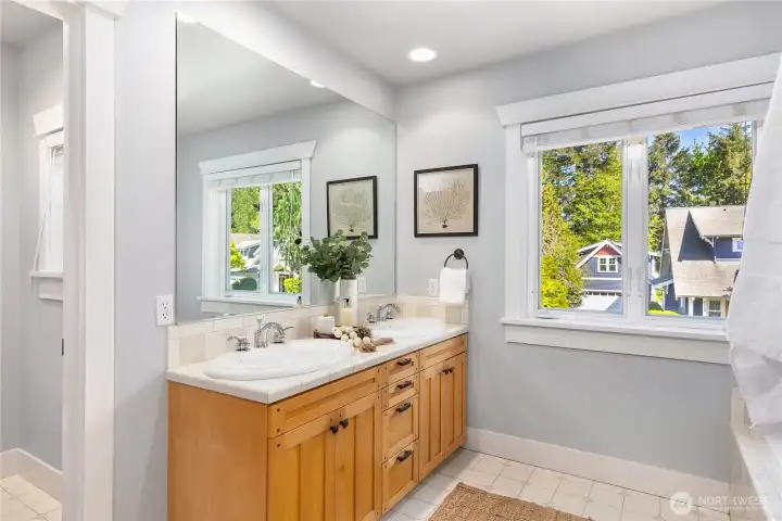 Primary bath with dual vanity, soaking tub and shower.