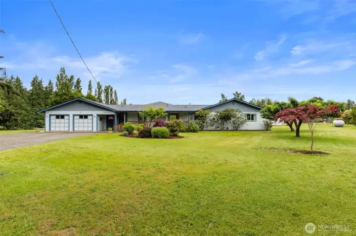 Lovely mature landscaping with tons of yard space to expand, garden or play