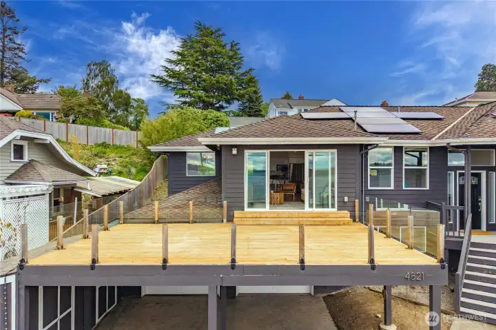 This oversized cedar deck w/sleek glass railing is perfectly positioned to capture breathtaking views of the Puget Sound, its ideal for outdoor dining, entertaining or relaxing sunsets. This oversized cedar deck w/sleek glass railing is perfectly positioned to capture breathtaking views of the Puget Sound, its ideal for outdoor dining, entertaining or relaxing sunsets.