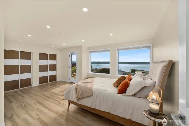 Enter thru the french doors into your spacious primary suite, a sanctuary with beautiful views, featuring its own private deck. Enter thru the french doors into your spacious primary suite, a sanctuary with beautiful views, featuring its own private deck.