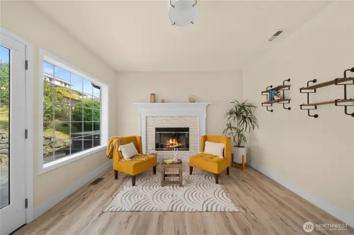 The cozy sitting area is centered around this charming wood burning fireplace. The perfect place to unwind on chilly Pacific Northwest evenings. The cozy sitting area is centered around this charming wood burning fireplace. The perfect place to unwind on chilly Pacific Northwest evenings.