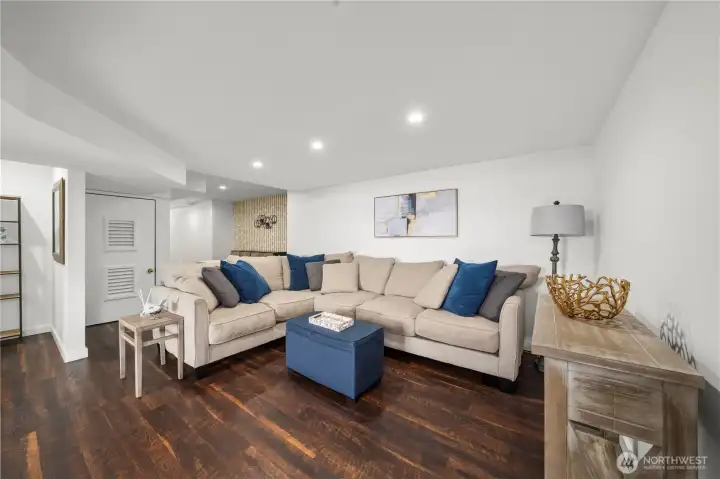 Downstairs living room is large enough for a large sofa. Downstairs living room is large enough for a large sofa.