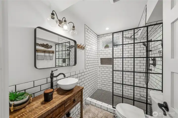 Beautifully updated ¾ bath featuring modern finishes and thoughtful design. Beautifully updated ¾ bath featuring modern finishes and thoughtful design.