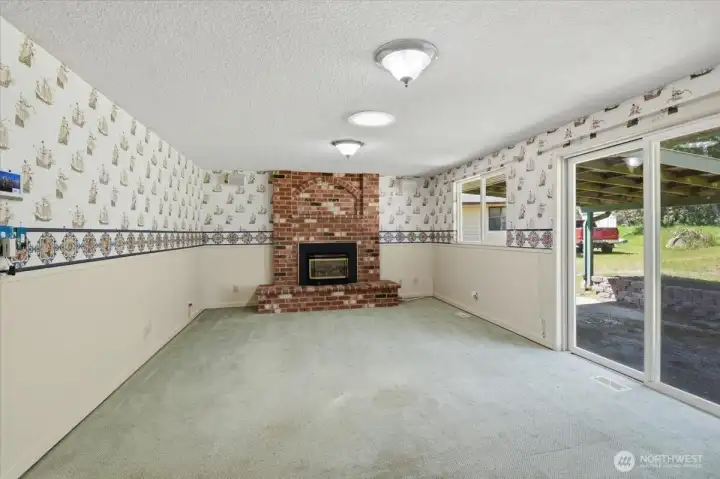 Nice sized Family Room with Gas Insert off of the Galley Kitchen. Sliding doors lead to partially covered patio.