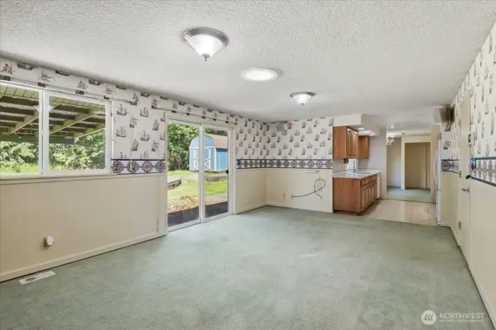 Family Room looking towards the Galley Kitchen. Garage door is on the right.