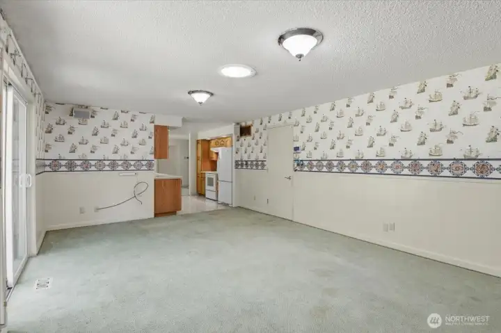 Family Room looking towards the Galley Kitchen. Garage door is on the right.
