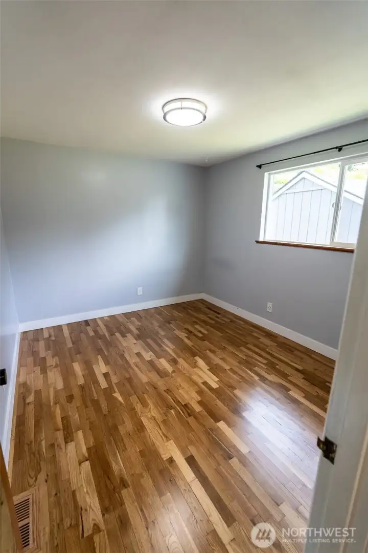 Bedroom #2 view, love the flooring and updated light fixtures throughout this home!