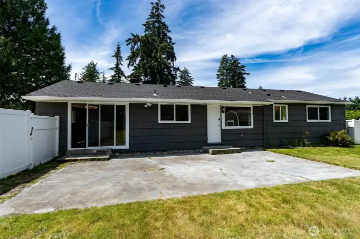 View of the back of the home, gate to your left leads to your second driveway.